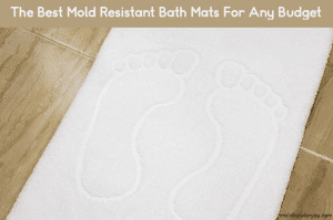 A white mold resistant bath mat on a wood floor