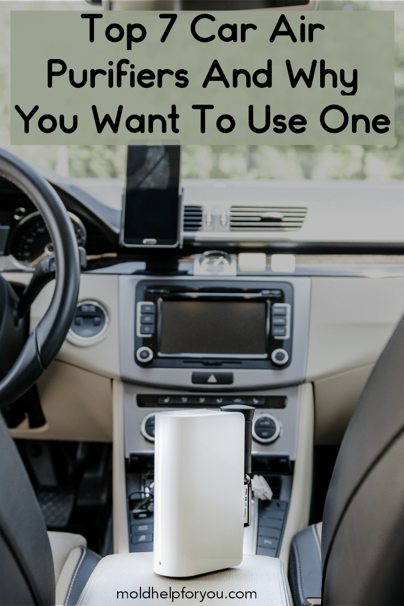 A car air purifier sitting on the center console of a car