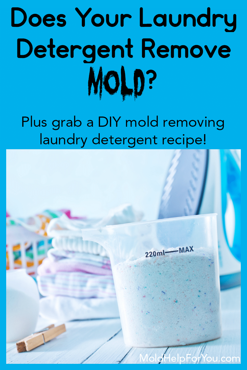 A cup full of powdered laundry detergent to remove mold. It is next to a stack of folded wash clothes and an iron.