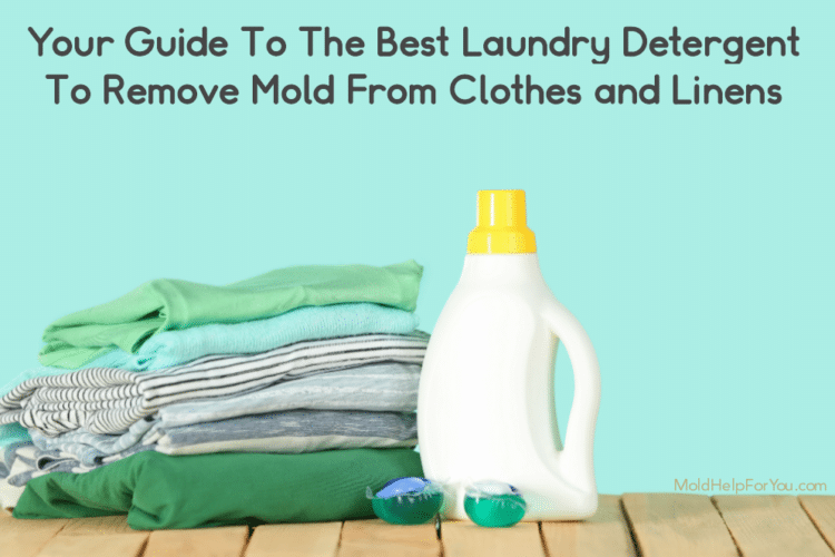A bottle of DIY laundry detergent to remove mold from clothes and linens. It is next to a pile of clean towels against an aqua background