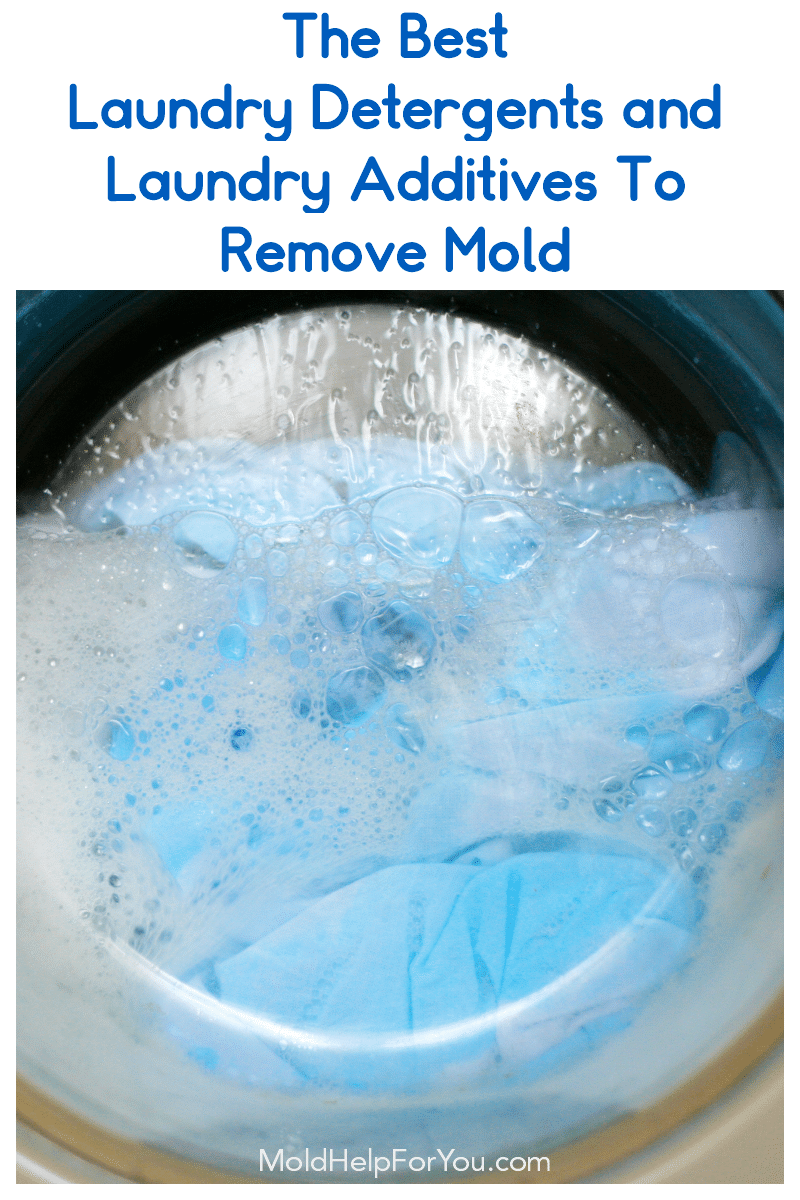 A look inside the clear door of a front load washing machine. A load of laundry is being washed with the best liquid laundry detergent to remove mold. 